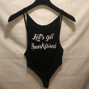 Black bodysuit with white writing